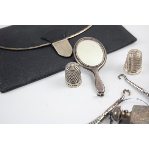 2196 - Nine sterling silver items to include mirror necklace pendant, button hooks etc. - approx. gross wei... 