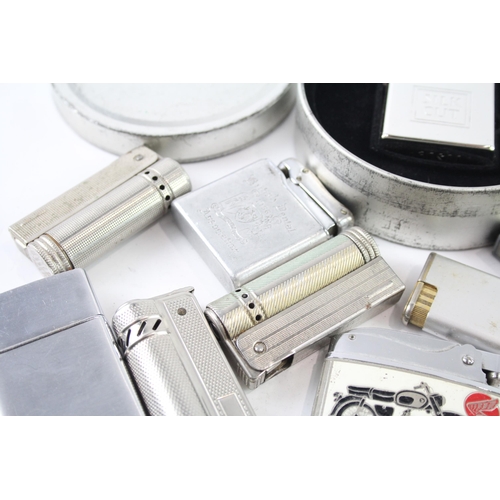 2205 - A collection of cigarette lighters to include silver plate, brass etc.