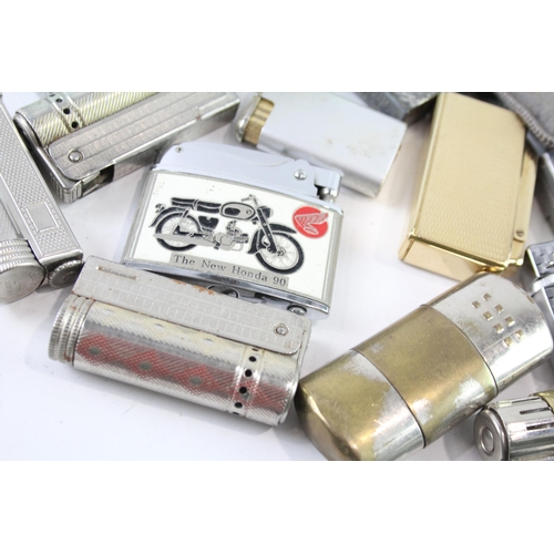 2205 - A collection of cigarette lighters to include silver plate, brass etc.