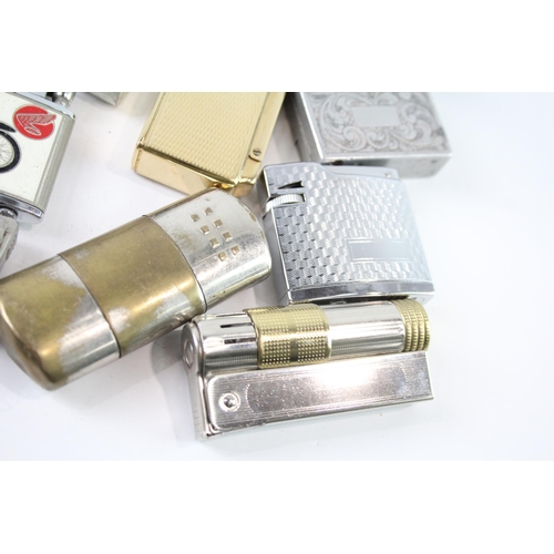 2205 - A collection of cigarette lighters to include silver plate, brass etc.