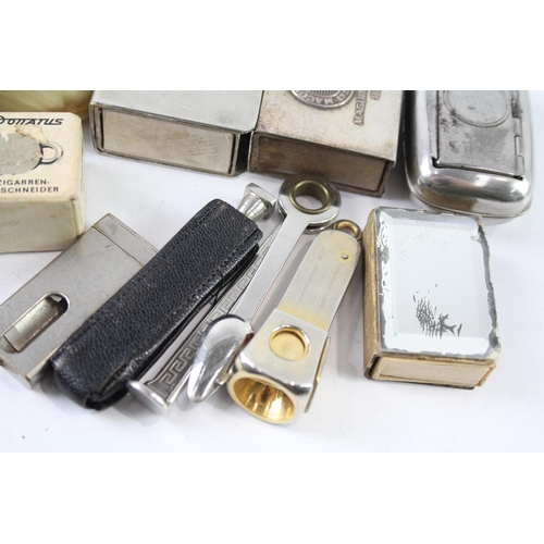 2206 - Ten pieces of tobacciana to include cigar cutters, matchbox holders etc.