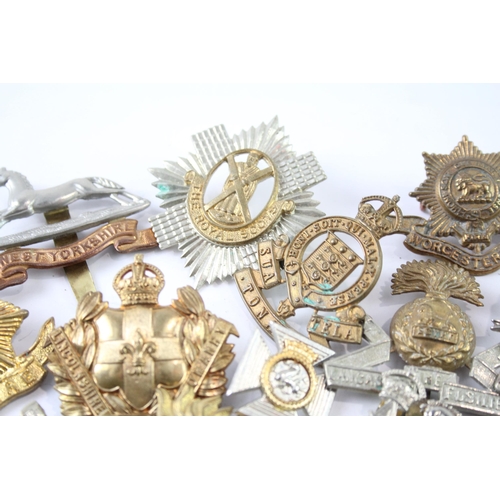 2241 - A collection of military cap badges