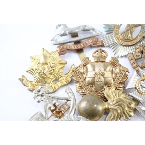 2241 - A collection of military cap badges