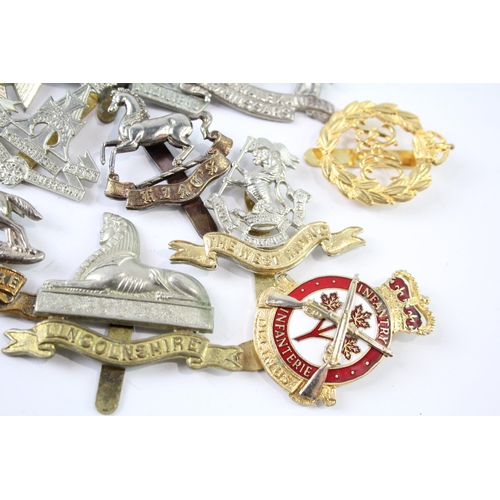 2241 - A collection of military cap badges