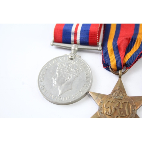 2247 - A boxed WWII medal group comprising The Burma Star, The Italy Star, The France and Germany Star, The... 