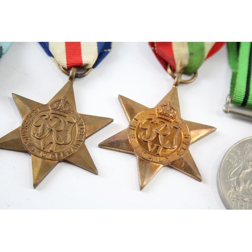 2247 - A boxed WWII medal group comprising The Burma Star, The Italy Star, The France and Germany Star, The... 