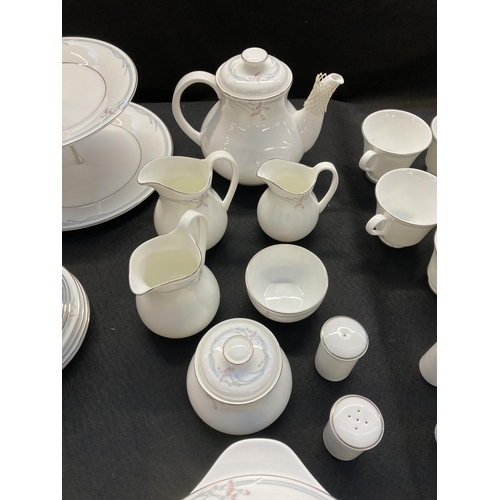 330 - Approx. eighty two pieces of Royal Doulton Carnation bone china to include six tea cups and saucers,... 