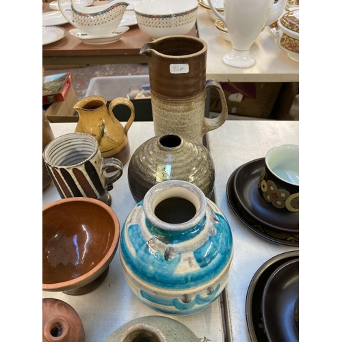 334 - A collection of 20th century ceramics to include Chinese Yixing clay teapot, studio pottery bottle n... 