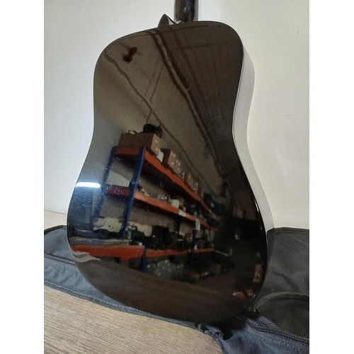 756 - A TGI padded gig bag containing Squier by Fender SA-105 sunburst dreadnought steel-strung acoustic g... 