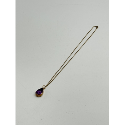 2067 - A 9ct gold amethyst pendant on 14ct gold child's necklace - approx. weight of necklace 1.08g and app... 