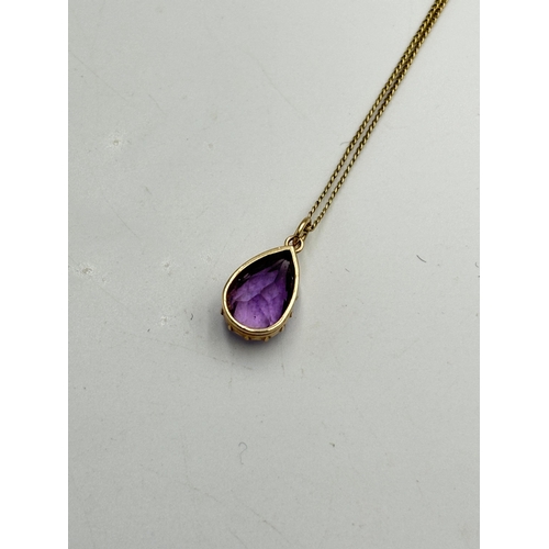 2067 - A 9ct gold amethyst pendant on 14ct gold child's necklace - approx. weight of necklace 1.08g and app... 