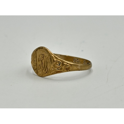 2076 - A hallmarked Birmingham 9ct gold signet ring, size P - approx. gross weight 1.67g