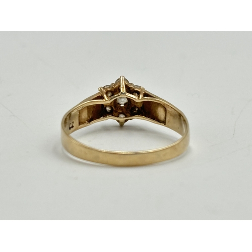 2097 - A hallmarked 9ct gold CZ floral cluster ring, size S - approx. gross weight 1.9g