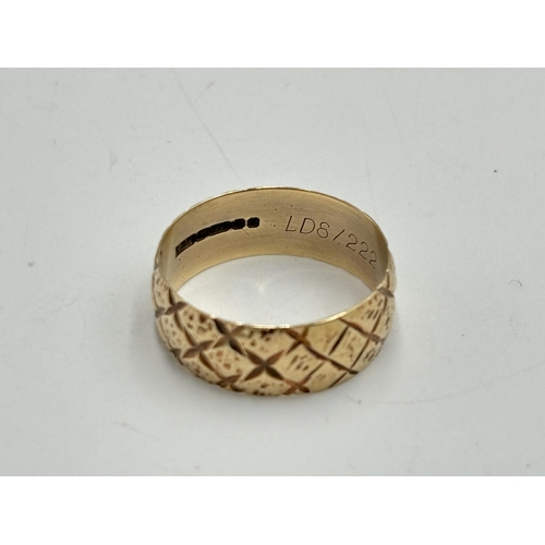 2099 - A hallmarked Birmingham 9ct gold band ring, size S, dated 1976 - approx. gross weight 3.8g