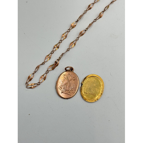 2101A - A hallmarked Chester 9ct gold locket with yellow metal chain necklace - approx. weight of locket 4.5... 