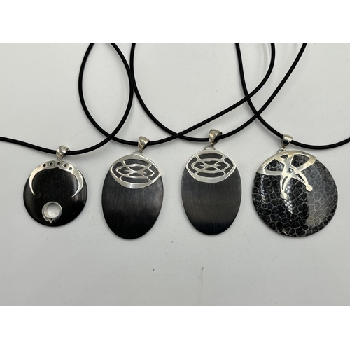 2101C - Four cased .925 silver ebony pendant necklaces