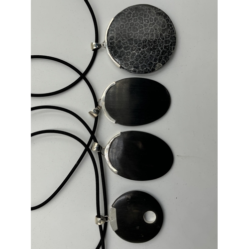 2101C - Four cased .925 silver ebony pendant necklaces