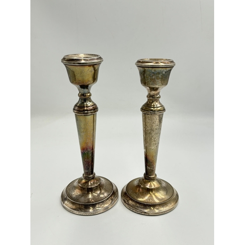 2140 - Two A T Cannon Ltd hallmarked Birmingham silver weighted candlesticks, one dated 1972 and one dated ... 