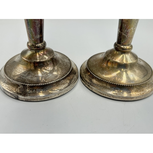 2140 - Two A T Cannon Ltd hallmarked Birmingham silver weighted candlesticks, one dated 1972 and one dated ... 