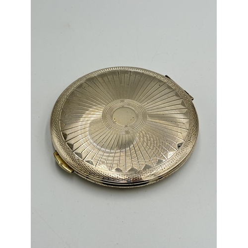 2142 - A Kigu hallmarked London silver compact mirror, dated 1964 - approx. gross weight 103g