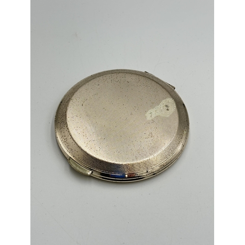 2142 - A Kigu hallmarked London silver compact mirror, dated 1964 - approx. gross weight 103g