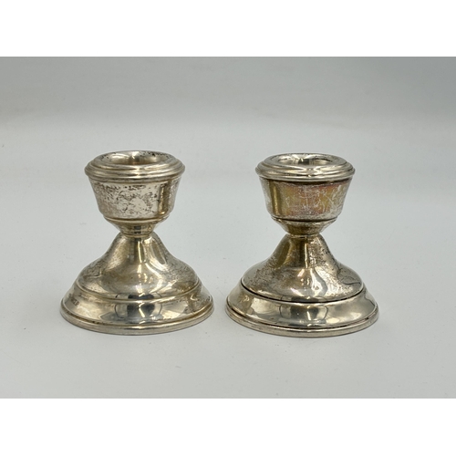 2151 - A pair of W I Broadway & Co hallmarked Birmingham silver weighted candlesticks, dated 1964 - approx.... 