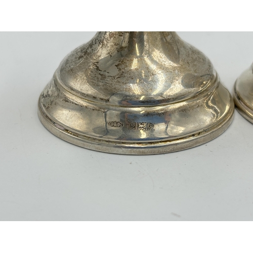 2151 - A pair of W I Broadway & Co hallmarked Birmingham silver weighted candlesticks, dated 1964 - approx.... 