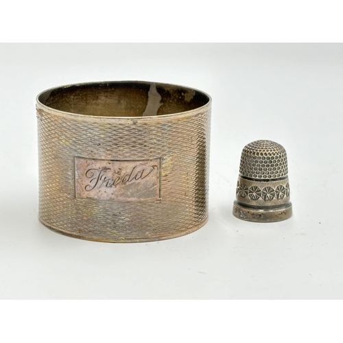 2153 - Two pieces of hallmarked sterling silver, one Birmingham napkin ring dated 1943 and one Sheffield th... 