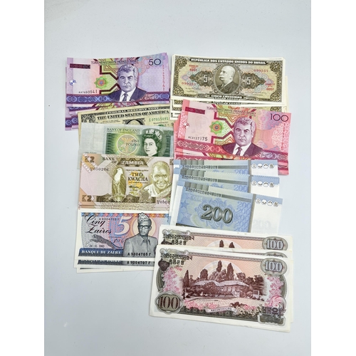 2220 - A collection of world banknotes to include Central Bank of Iraq, six 1978 North Korea one-hundred wo... 