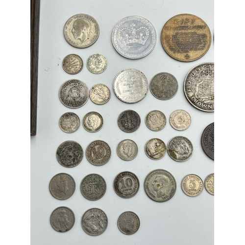 2221 - A collection of world coins to include 90% silver 'Walking Liberty Half Dollar', 83.5% silver 1935 o... 