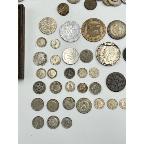 2221 - A collection of world coins to include 90% silver 'Walking Liberty Half Dollar', 83.5% silver 1935 o... 