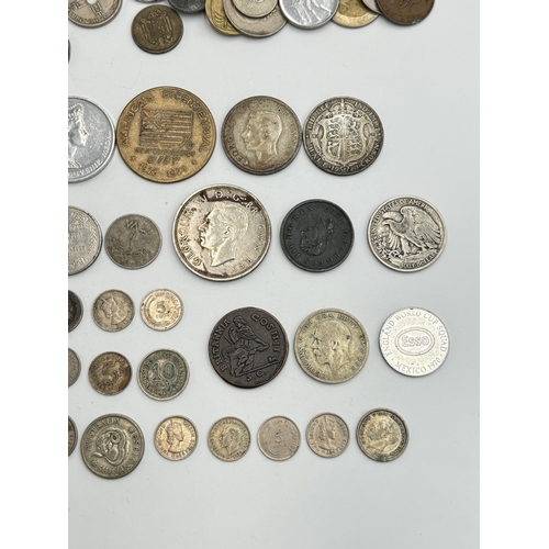 2221 - A collection of world coins to include 90% silver 'Walking Liberty Half Dollar', 83.5% silver 1935 o... 