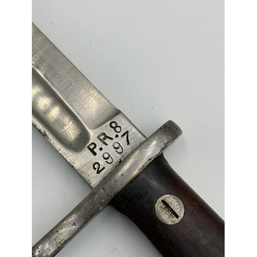 2257 - A WWI Spanish Mauser bayonet and scabbard - approx. 37cm long and blade approx. 25cm