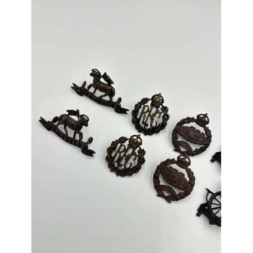 2267 - Ten military cap and collar badges