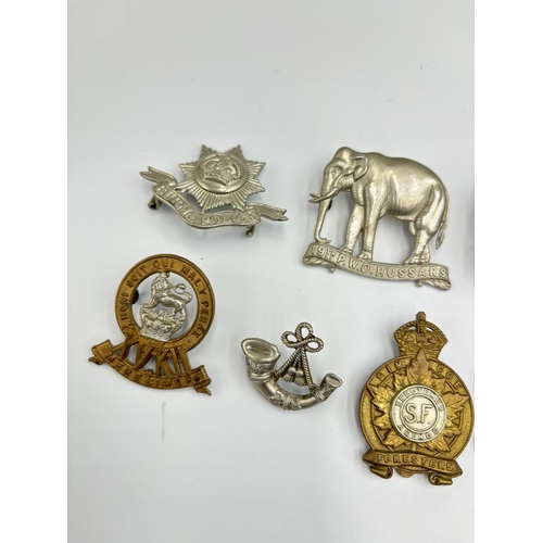 2296 - Ten military cap badges