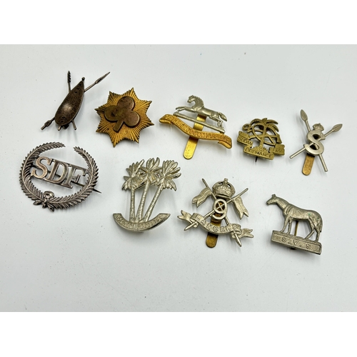 2302 - Nine military cap badges to include SDF hallmarked sterling silver - approx. gross weight 16.6g