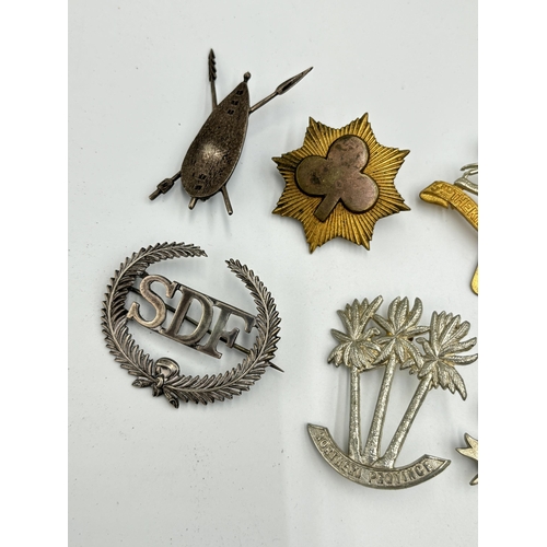 2302 - Nine military cap badges to include SDF hallmarked sterling silver - approx. gross weight 16.6g