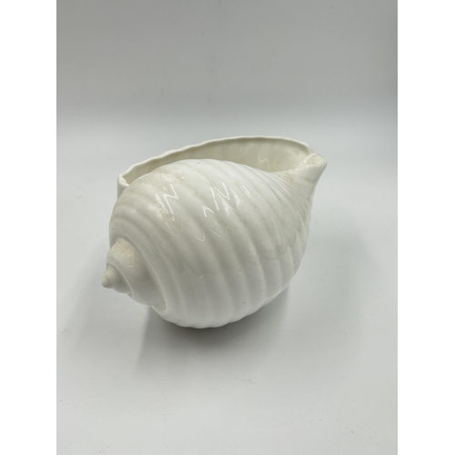 283 - Two pieces of Wedgwood bone china, one Griffin candleholder and one Nautilus Collection shell plante... 