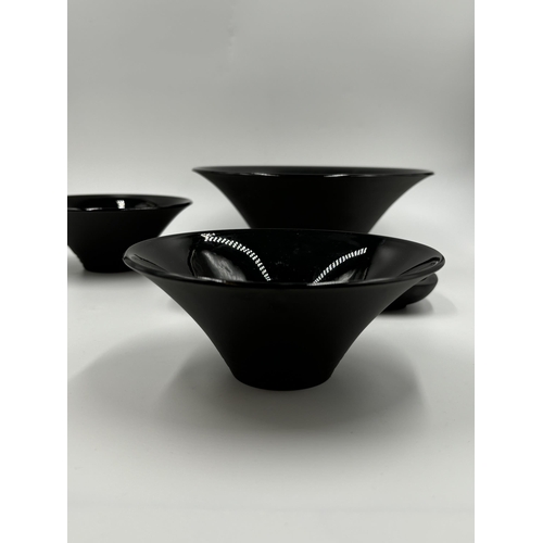 288 - Five pieces of Wedgwood black basalt pottery, three bowls - largest approx. 23cm diameter and two di... 