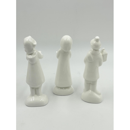 295 - Three Royal Doulton Images Christmas Choir Limited Edition figurines, Carol Singer Brother No. 556/6... 