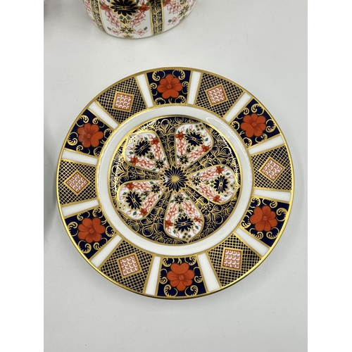 296 - Six pieces of Royal Crown Derby 1128 Old Imari bone china, two 16cm side plates, one teacup, one sau... 