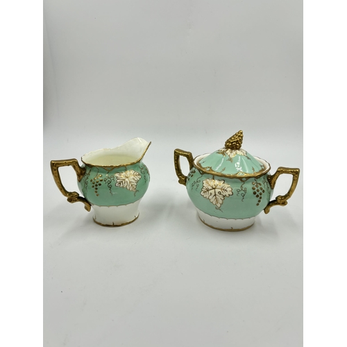 297 - Five pieces of Royal Crown Derby Vine bone china, two teacups, one saucer, one sugar bowl and one mi... 