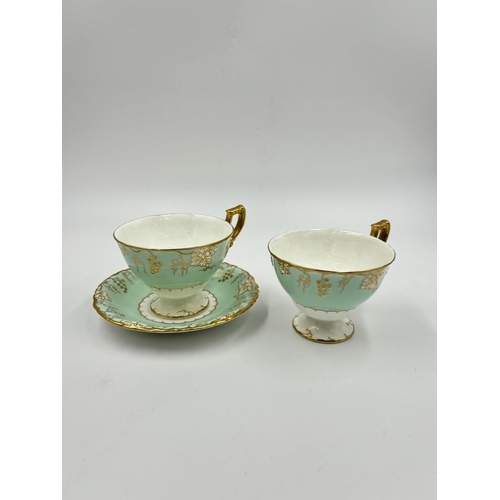 297 - Five pieces of Royal Crown Derby Vine bone china, two teacups, one saucer, one sugar bowl and one mi... 