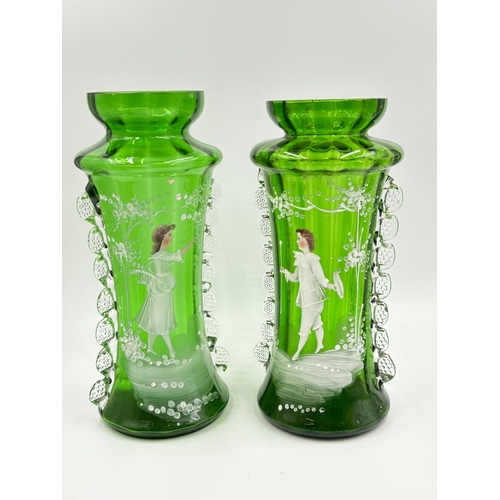 301 - Three Victorian Mary Gregory hand painted green glass vases - largest approx. 28cm high