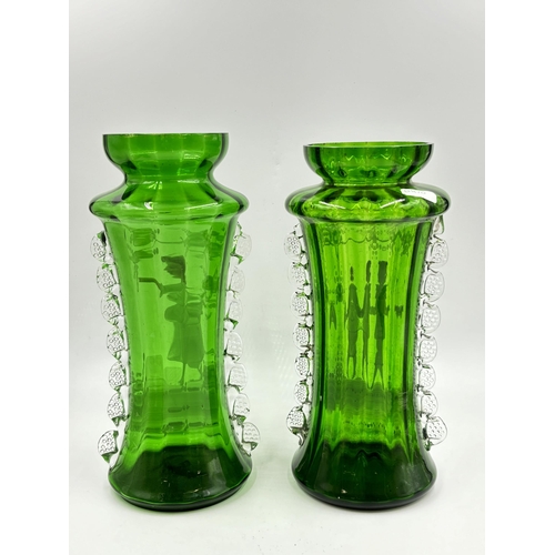 301 - Three Victorian Mary Gregory hand painted green glass vases - largest approx. 28cm high