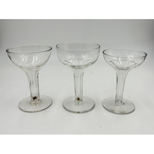 308 - Five early 20th century fluted stem champagne glasses - largest approx. 12.5cm high