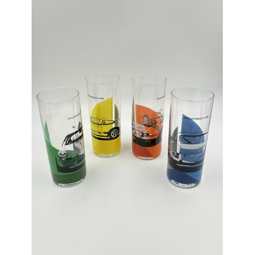 312 - A boxed set of four Porsche long drink glasses - approx. 16.5cm high