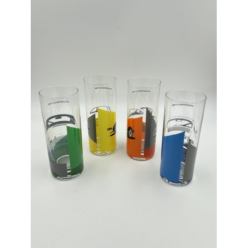 312 - A boxed set of four Porsche long drink glasses - approx. 16.5cm high