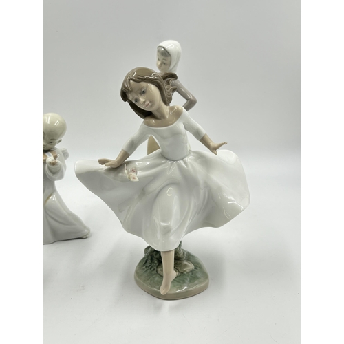 314 - Four Lladro porcelain figurines - largest approx. 24cm high