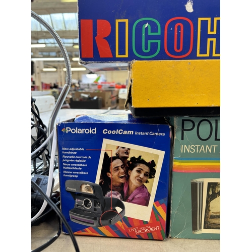 727 - A collection of boxed cameras to include Olympus AZ-330 Superzoom, Ricoh RZ-900 Date, Polaroid The B... 